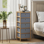 Narrow chest of drawers with five light grey fabric drawers and bamboo frame