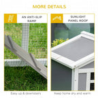 Grey rabbit hutch showing ramp up to a sunlight panel roof section