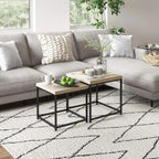 Set of 2 rectangular nest tables with light oak tops and black frames in living room