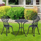 Black round bistro table with two matching ornate metal chairs for outdoor patio