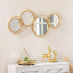 Gold-tone metal wall mirror set with five interlocking circular frames and central mirror
