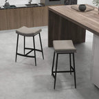 Grey bar stools with curved seats and black steel frames