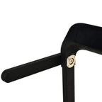 Black treadmill handrail and console support post, close-up