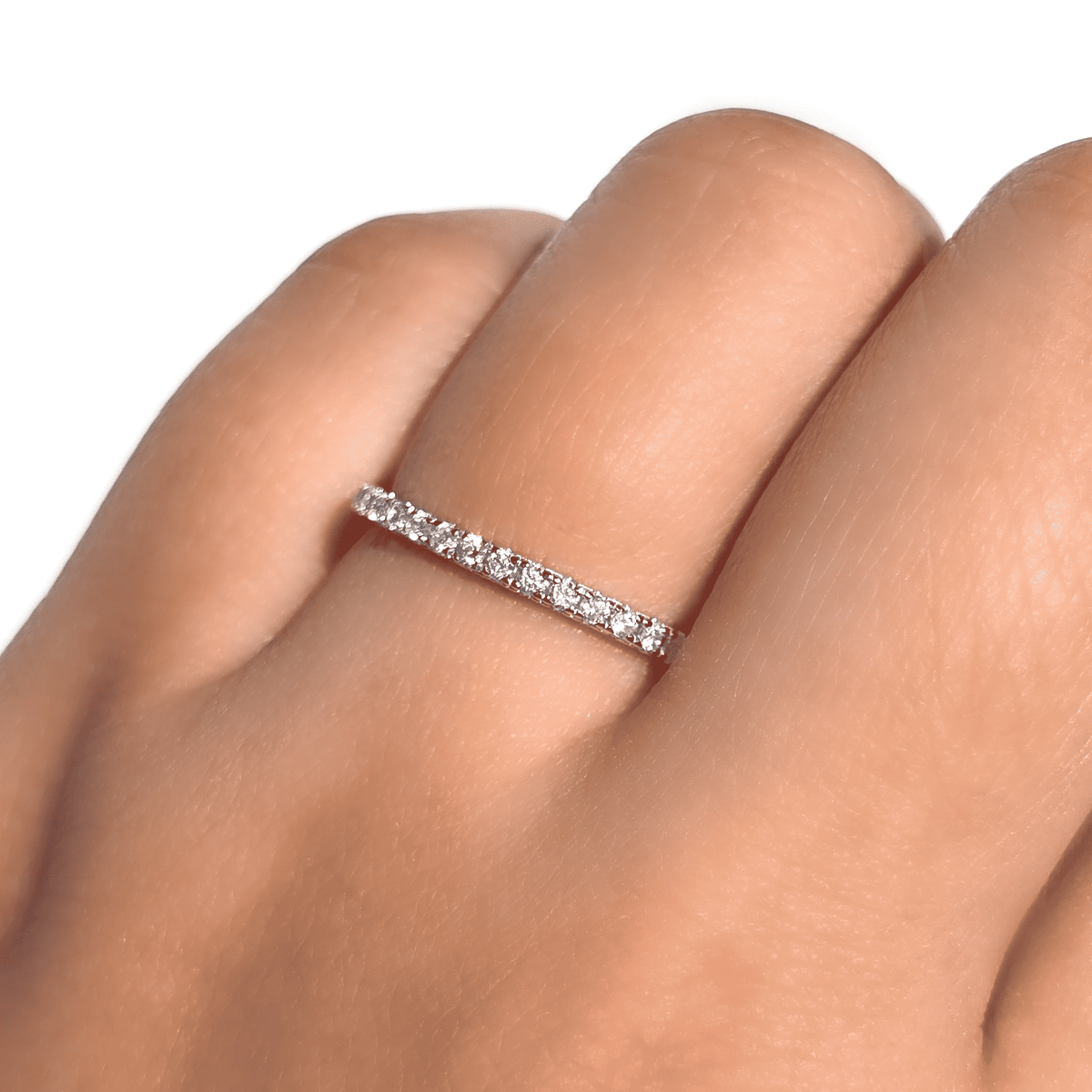 Sterling silver eternity ring with pavé stones on a finger