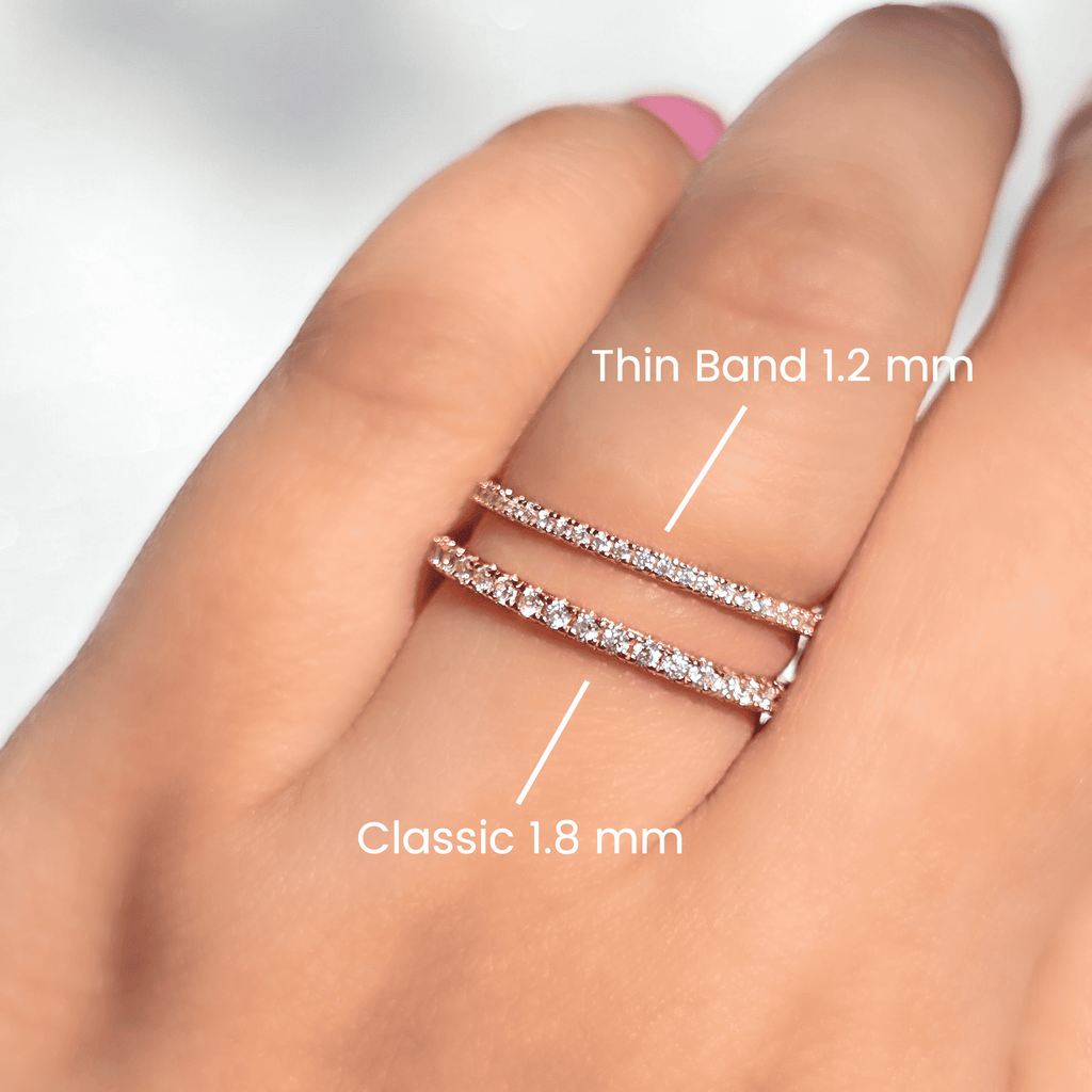 Rose gold eternity ring with pavé stones on a finger