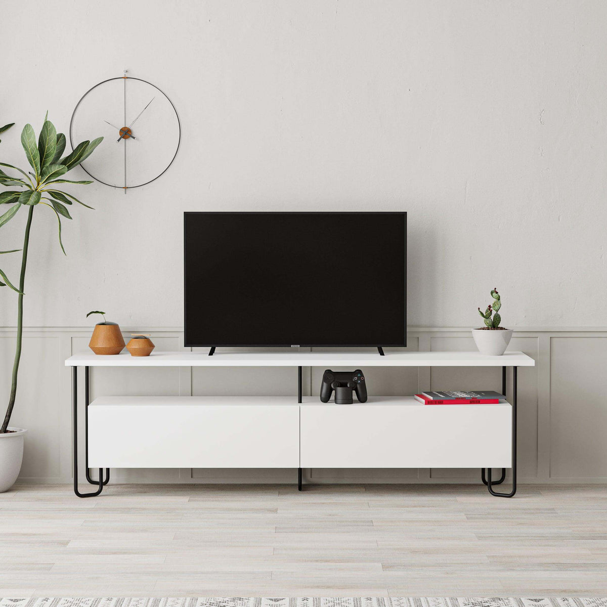 Modern TV unit with storage cabinet, black top and white base, cabinet doors and media shelf