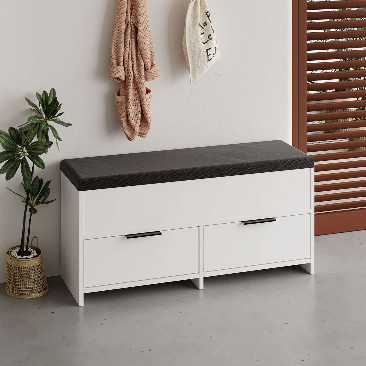 White shoe storage bench with dark cushioned seat and two storage drawers