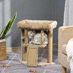 Brown cat tree tower with top perch and enclosed cubby; cat sits inside near jute scratch pad