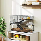 Black wire hamster cage with deep base, dark ramp and platforms, yellow wheel and water bottle