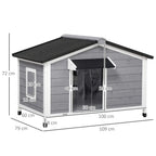 Grey wooden dog kennel with black roof mat and front and side openings, size view