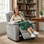Light grey power recliner armchair with raised leg rest and reclined backrest