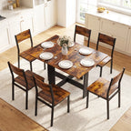 Rustic brown drop-leaf dining table with dark chairs arranged around it