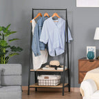 Black freestanding clothes rack with two wooden shelves and hanging bar with hooks