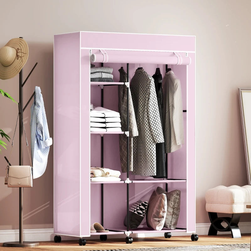 Pink fabric wardrobe with shelves and hanging rail, front view with folded and hanging items.