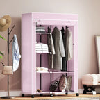 Pink fabric wardrobe with shelves and hanging rail, front view with folded and hanging items.
