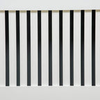 Close-up of white vertical slats on the radiator cover front grill.