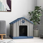 Indoor dog kennel in grey with blue roof; front opening and paw-print panel visible