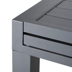 Dark grey end corner close-up of extendable outdoor dining table with slatted top underside