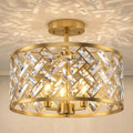 Gold-tone crystal ceiling light close-up with circular metal ring and faceted prisms