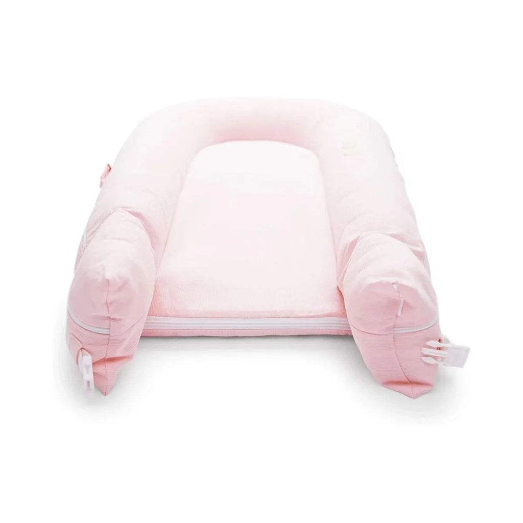 Pink cushioned infant dock with curved side bolsters and open front rim