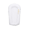 White baby dock insert with rounded headrest and handle loop