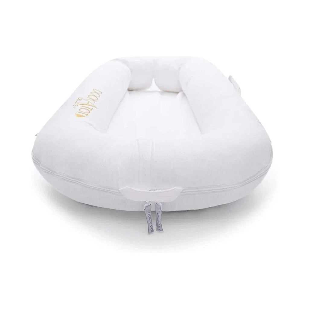 White rounded baby dock insert with cushioned sides and drawstring ties