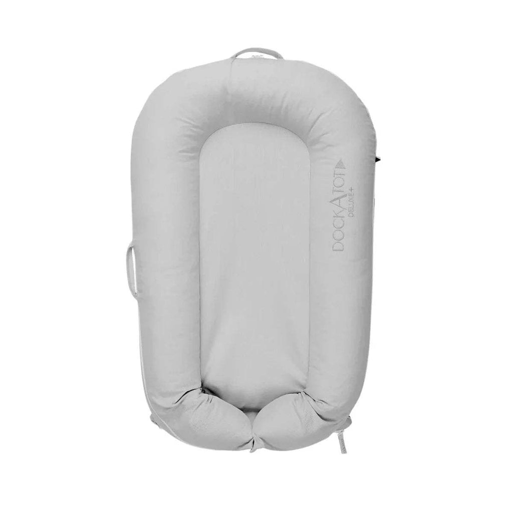 Light gray padded baby lounger dock with raised sides and inner bolster