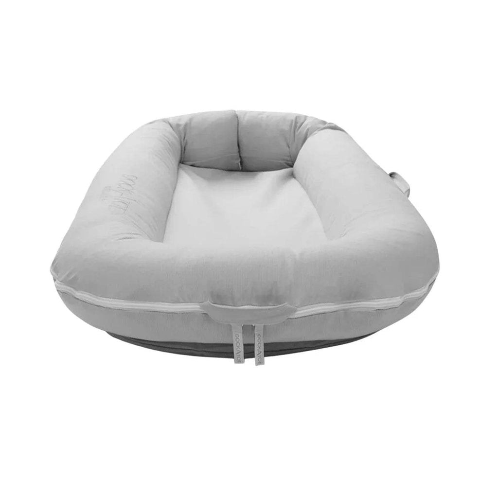 Light gray oval baby lounger dock with cushioned rim and drawstring ties