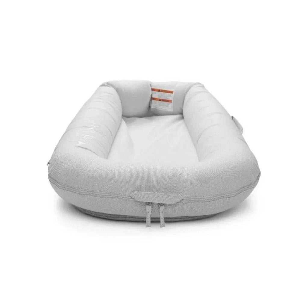 Light gray baby lounger dock open top view with inner padding and tie cords