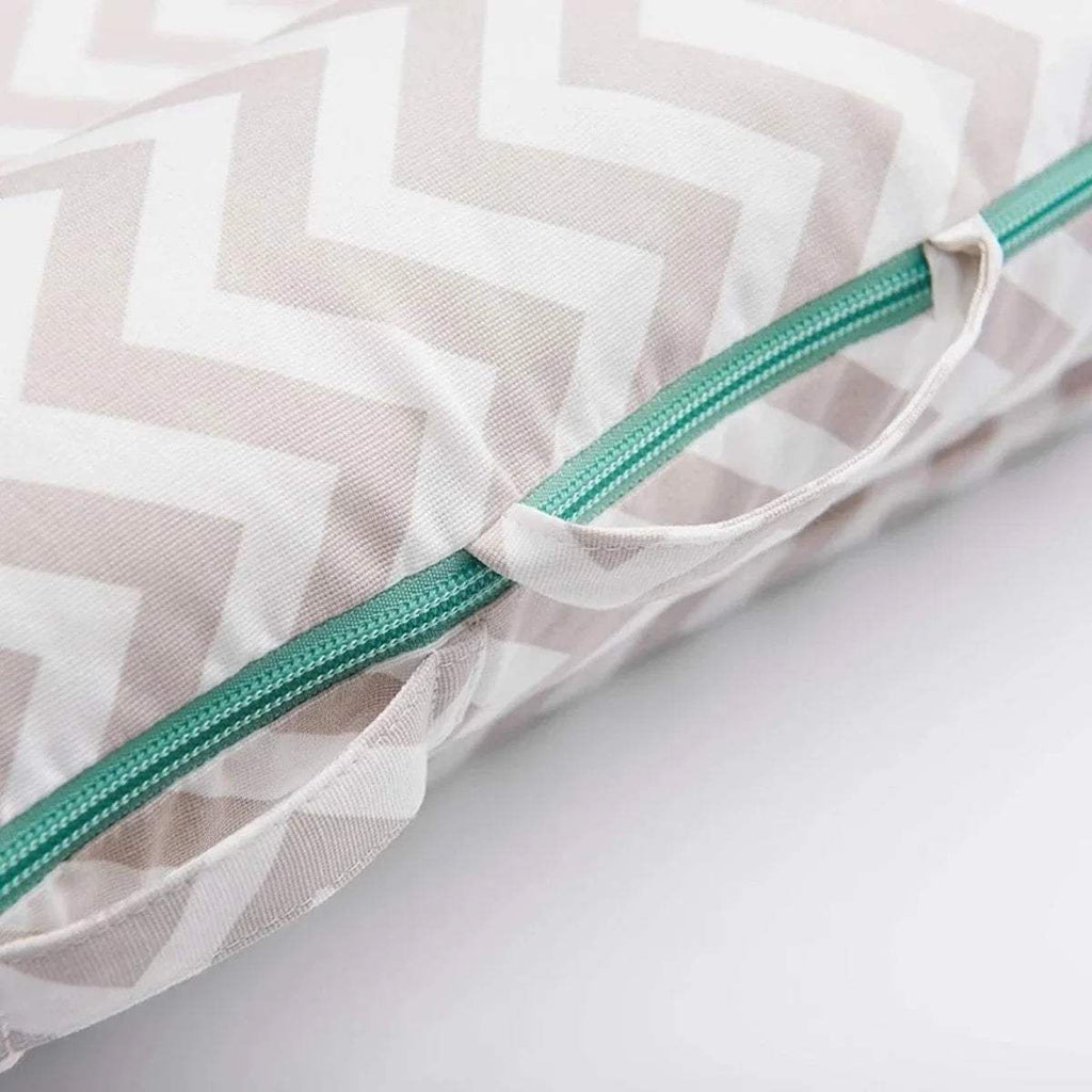 Chevron lounger cover detail with teal zipper track and tied edge