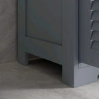 Grey bathroom storage cabinet base with open lower section beneath the drawer.