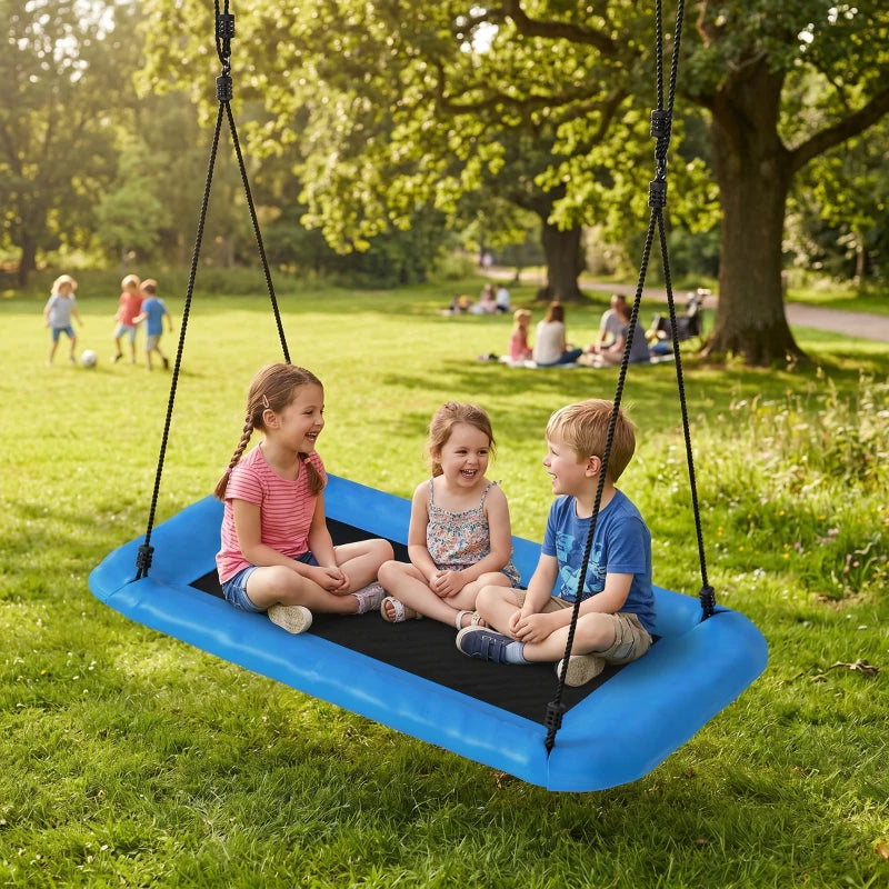 Blue nest swing in a park with four kids sitting on the black platform