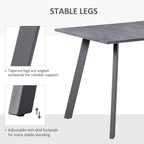 Charcoal grey dining table with angled tapered metal legs and non-skid footpads