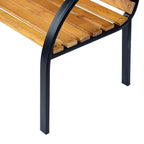 Close-up of natural wood slat seat and black steel leg of 2-seat garden bench
