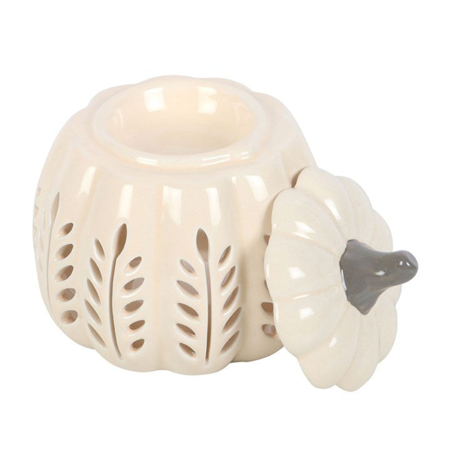 Ceramic pumpkin-shaped oil burner with decorative cutouts on a white background