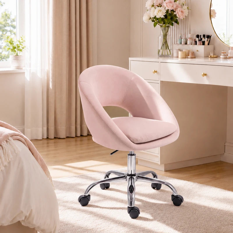 Pink velvet office chair with curved back, padded seat, and chrome caster base