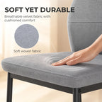 Grey velvet bar stool seat cushion with curved back, black metal legs