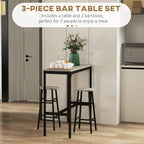 Industrial bar table set with grey top and two grey stools, black metal frame