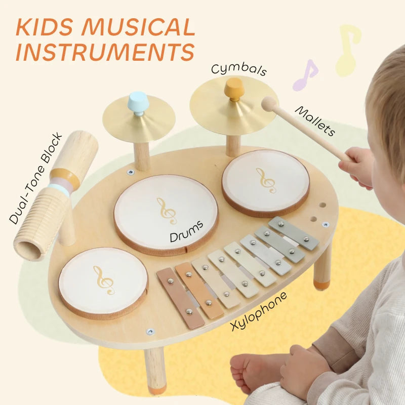 Baby wooden drum kit with mallets, three white drums, cymbals, and xylophone keys