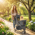Dark grey 3-wheel pet stroller with canopy carrying a small dog outdoors