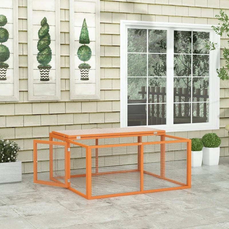 Orange wooden rabbit hutch with wire mesh panels and hinged top.