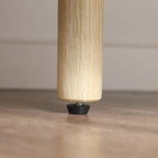 Close-up of natural wood-effect cabinet leg with leveling foot