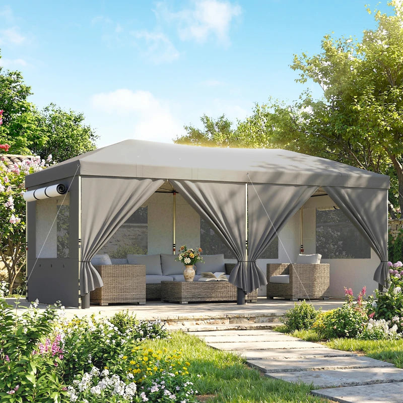 Dark grey pop-up canopy tent with six sidewalls and outdoor seating inside