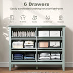Green fluted dresser with six open drawers showing folded-clothing storage areas