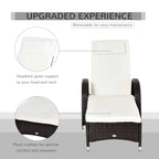 Dark brown rattan sun lounger with white headrest cushion and full-length seat cushion