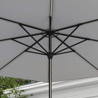 Light grey parasol canopy with black metal ribs and central hub
