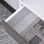 White bookcase with open lower drawer compartment and grey interior panel; light wood legs.