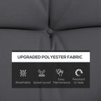 Charcoal grey cushion with tufted buttons and textured fabric upholstery