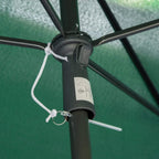 Close-up of green parasol tilt control hub with rope and black pole frame