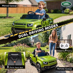 Green kids ride-on car on driveway with child in driver seat and remote control nearby